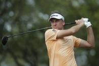 Mar 24, 2018; Austin, TX, USA; Ian Poulter of England tees off on number 8 playing against Kevin Kisner of the United States during the fifth round of the WGC - Dell Technologies Match Play golf tournament at Austin Country Club. Mandatory Credit: Erich Schlegel-USA TODAY Sports