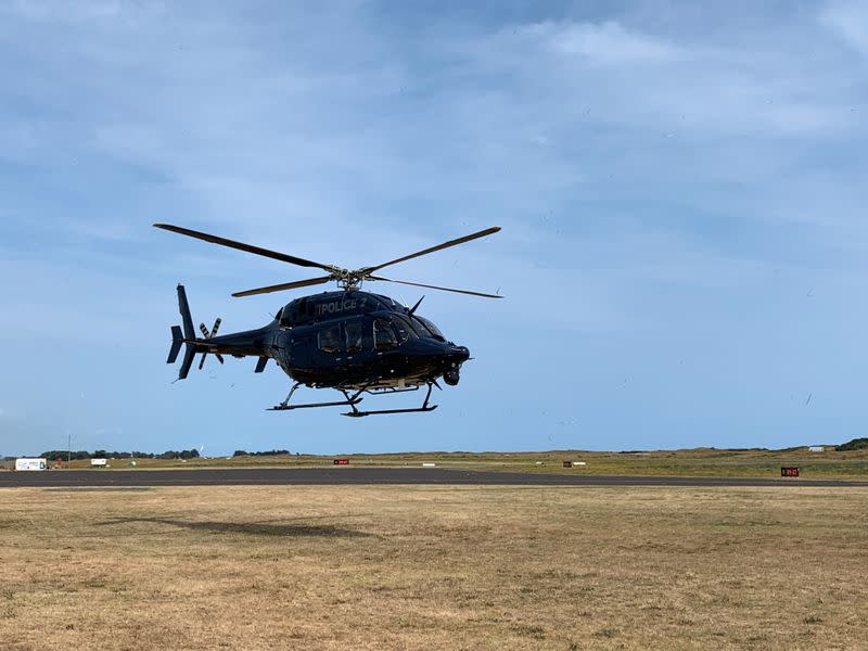 A New Zealand Police helicopter returns to Whakatane after conducting a search for bodies in the aftermath of the eruption of White Island volcano