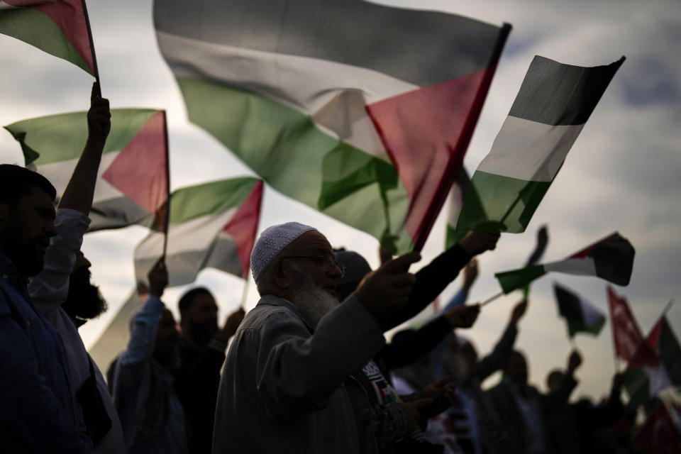 FILE - Pro Palestinian people wave Palestinian flags as they gather before departing in a vehicles convoy to protest and show their solidarity with the Palestinians, in Istanbul, Turkey, on Nov. 3, 2023. Antisemitism is spiking across Europe after Hamas' Oct. 7 massacre and Israel's bombardment of Gaza, worrying Jews from London to Geneva and Berlin. (AP Photo/Francisco Seco, File)
