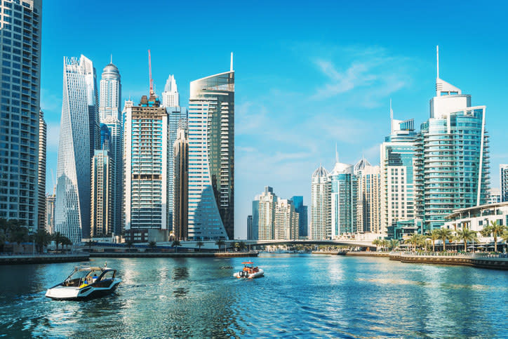 A canal with skyscrapers in the background