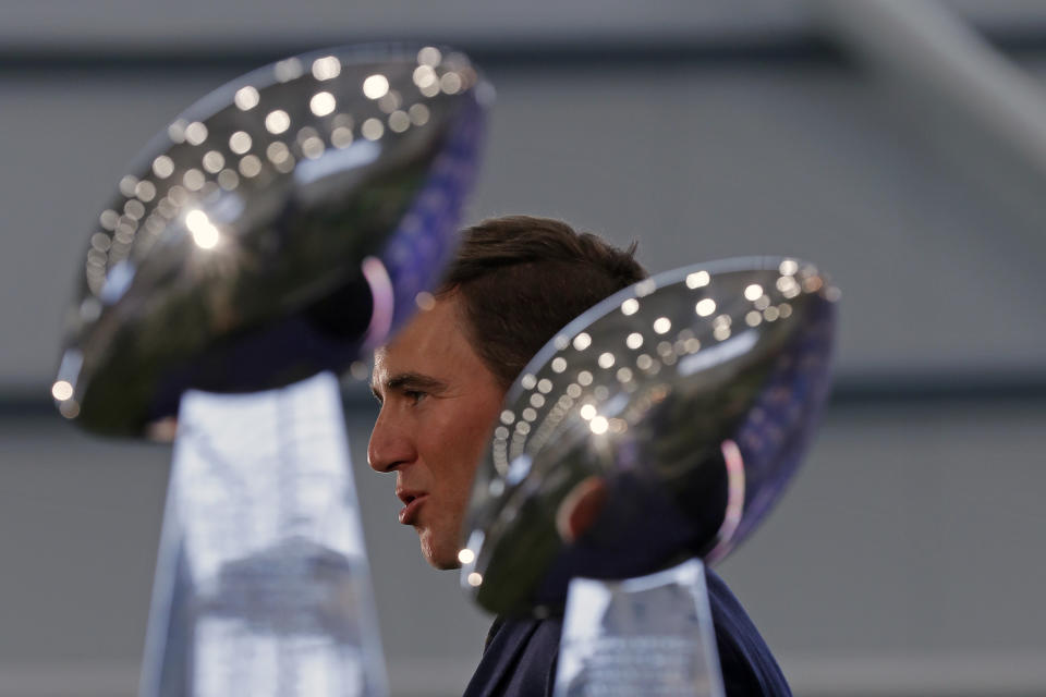 New York Giants NFL football quarterback Eli Manning announces his retirement on Friday, Jan. 24, 2020, in East Rutherford, N.J. In the foreground are Super Bowl XLII and XLVI trophies. (AP Photo/Adam Hunger)