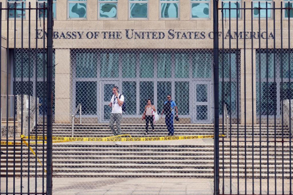 Workers at the U.S. Embassy in Havana leave the building on Sept. 29, 2017, after the State Department announced that it was withdrawing all but essential personnel from the embassy because Cuba could no longer guarantee diplomats’ safety. (Photo: Emily Michot/Miami Herald/TNS via Getty Images)