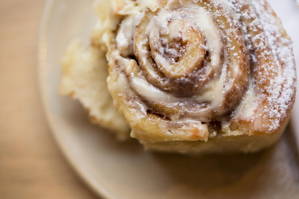 Close-up of tasty fresh cinnamon roll.