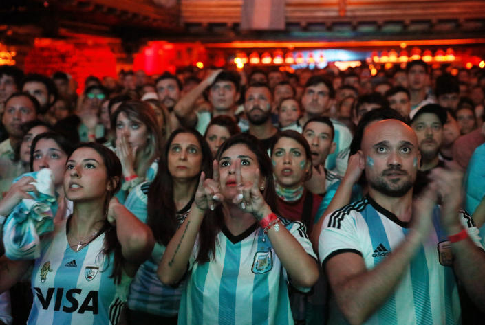 Soccer Football - FIFA World Cup Final Qatar 2022 - Fans in Madrid watch Argentina v France - Madrid, Spain - December 18, 2022  Argentina fans watch the match in a bar REUTERS/Isabel Infantes