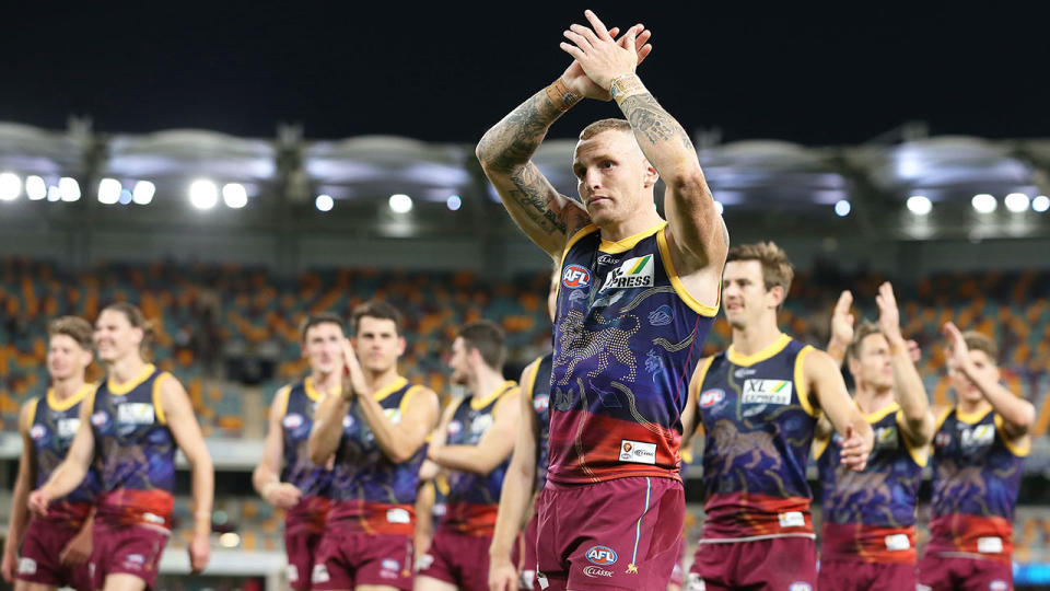 Pictured here, Brisbane Lions players thank fans after their round 13 win over St Kilda.