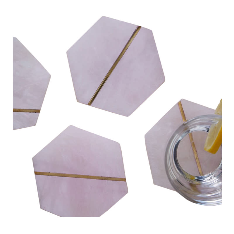 <a rel="nofollow noopener" href="http://rstyle.me/n/ck6agsjduw" target="_blank" data-ylk="slk:Decked Out Pink Stone Coasters, West Elm, $39;elm:context_link;itc:0;sec:content-canvas" class="link ">Decked Out Pink Stone Coasters, West Elm, $39</a>