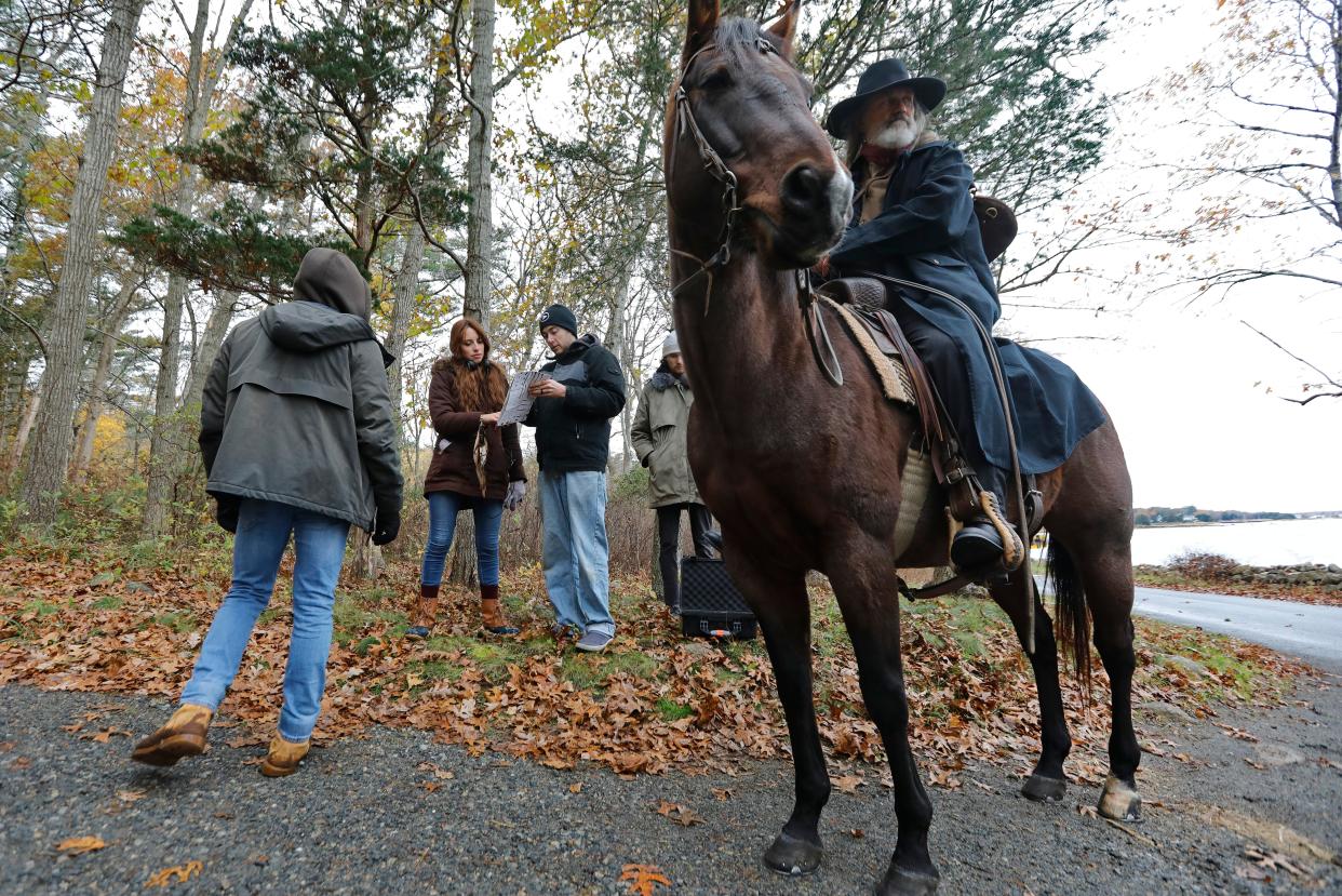 Director Alyssa Botelho works with production designer, Todd Migliacci, during filming of Sweet Freedom in Marion. On the horse Mark Bracich playing Ridgell waits for direction.