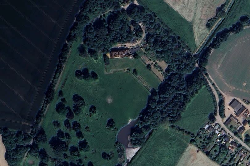 Aerial view of Quy Hall and its grounds.