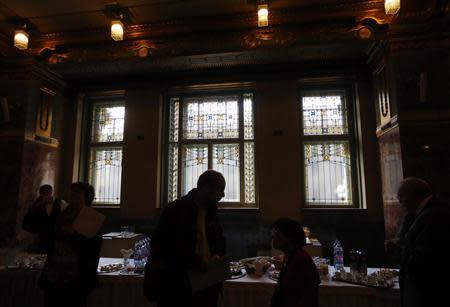 People talk in the lobby of the reopened Liszt Academy music school in Budapest October 21, 2013. REUTERS/Laszlo Balogh