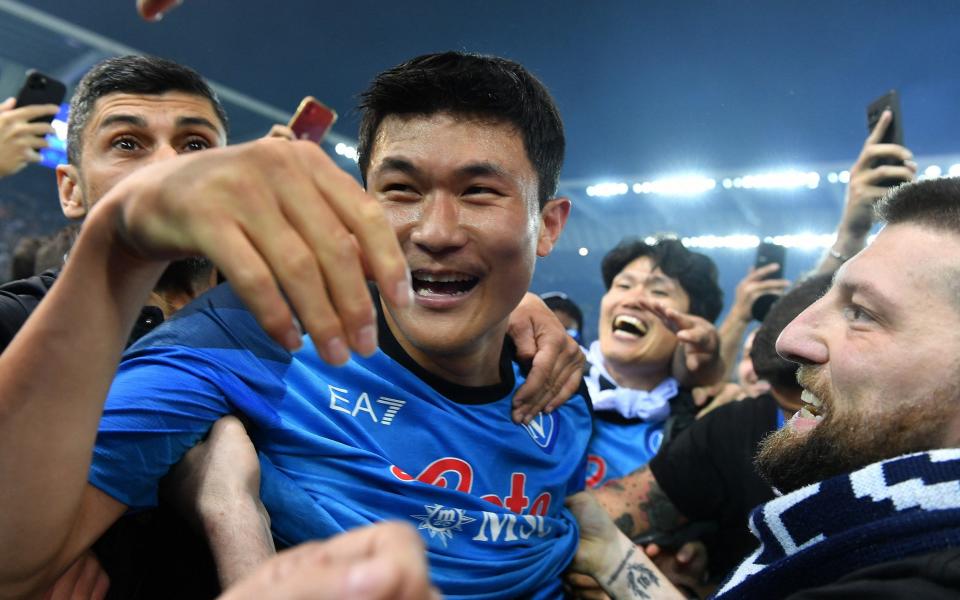 Udinese v Napoli - Dacia Arena, Udine, Italy - May 4, 2023 Napoli's Kim Min-jae celebrates with fans on the pitch after winning Serie A - Reuters/Jennifer Lorenzini