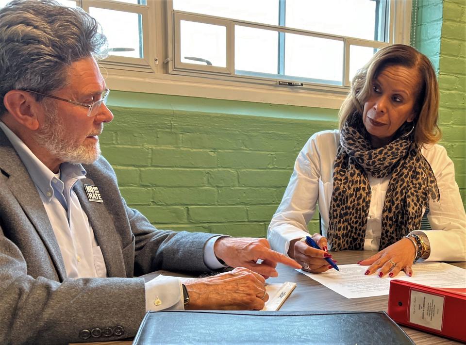 New Bedford Human Rights Commission Executive Director Marcelina Pina-Christian goes over commission meeting minutes with board Chairman Martin Bentz in this file photo.