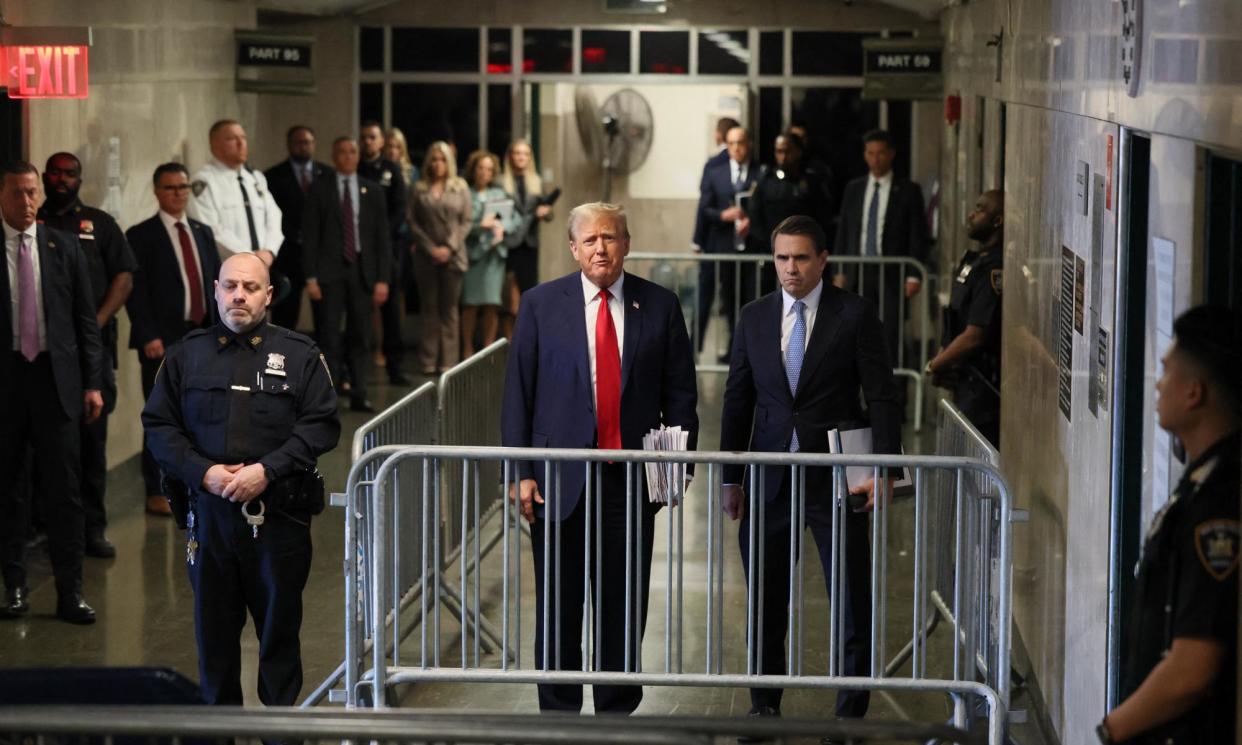 <span>Donald Trump, standing next to his attorney Todd Blanche, right, speaks to the press after attending his hush-money trial at Manhattan criminal court in New York City on 23 April.</span><span>Photograph: Brendan McDermid/AFP/Getty Images</span>