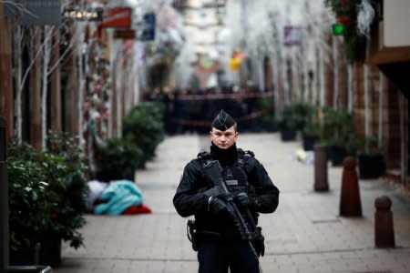 A French gendarme secures a street at the scene of a police operation the day after a shooting in Strasbourg, France, December 12, 2018.   REUTERS/Christian Hartmann