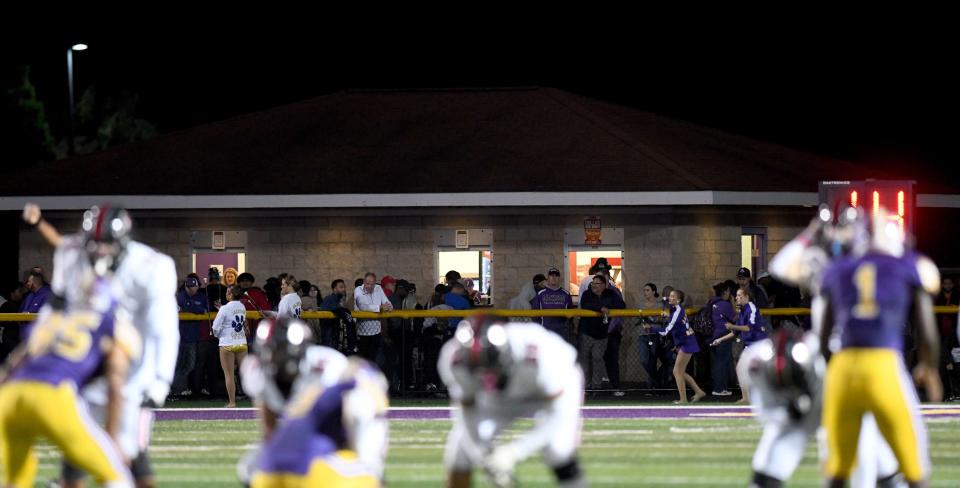 The Jackson Polar Bears play the Canton McKinley Bulldogs on the field at Robert Fife Stadium in Jackson Township as the bustling concession stand keeps volunteers busy off the field.