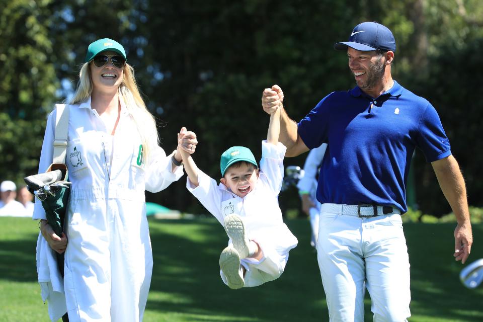 AUGUSTA, GEORGIA - APRIL 10: Paul Casey of England walks with wife Pollyanna and son Lex during the Par 3 Contest prior to the Masters at Augusta National Golf Club on April 10, 2019 in Augusta, Georgia. (Photo by Andrew Redington/Getty Images)