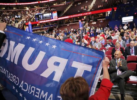 Trump sign is paraded at the Republican National Convention in Cleveland, Ohio, U.S. July 18, 2016. REUTERS/Brian Snyder