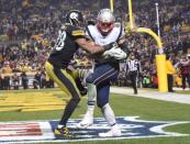 Dec 17, 2017; Pittsburgh, PA, USA; New England Patriots tight end Rob Gronkowski (87) catches a two point conversion in the fourth quarter as Pittsburgh Steelers safety Sean Davis (28) defends at Heinz Field. The Patriots won 27-24. Mandatory Credit: Philip G. Pavely-USA TODAY Sports