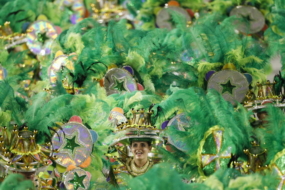 Dancers of Mocidade samba school parade during carnival celebrations at the Sambadrome in Rio de Janeiro, Brazil, Monday Feb. 20, 2012. (AP Photo/Felipe Dana)