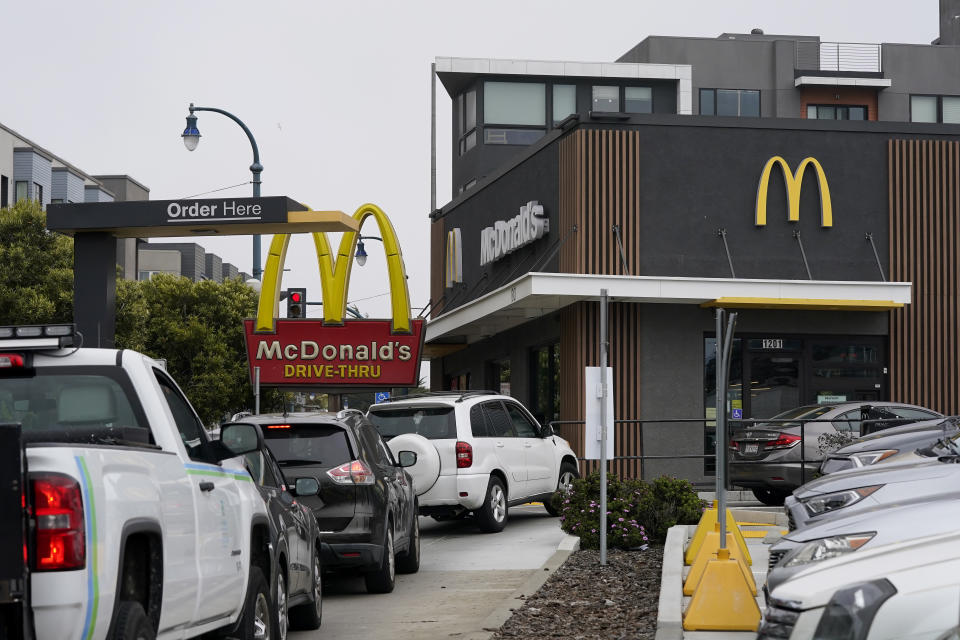 FILE - Cars wait in the drive-thru line at a McDonald's restaurant in San Francisco, Thursday, Aug. 25, 2022. California Gov. Gavin Newsom on Monday, Sept. 6, 2022, signed a nation-leading measure giving more than a half-million fast food workers more power and protections, despite the objections of restaurant owners who warned it would drive up consumers’ costs. (AP Photo/Jeff Chiu, File)