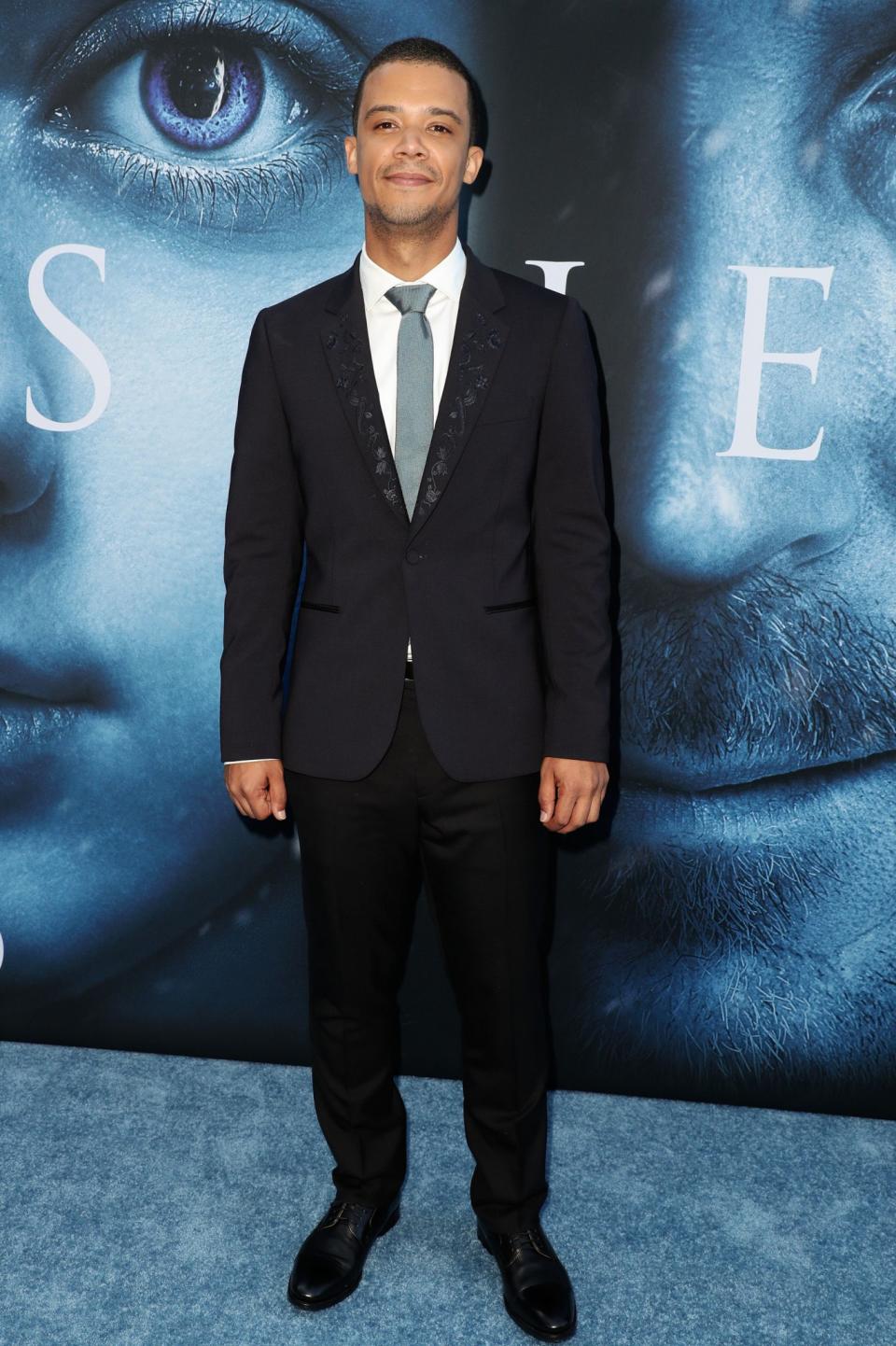 <p>Grey Worm arrived in a tailored black suit fitted with a stylish floral trim. (Photo: Rex) </p>