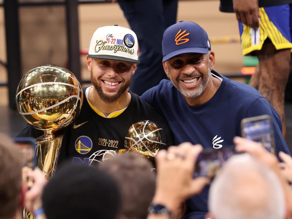 Stephen Curry #30 of the Golden State Warriors poses for a photo with his father, Dell Curry, after Game Six of the 2022 NBA Finals on June 16, 2022 at TD Garden in Boston, Massachusetts