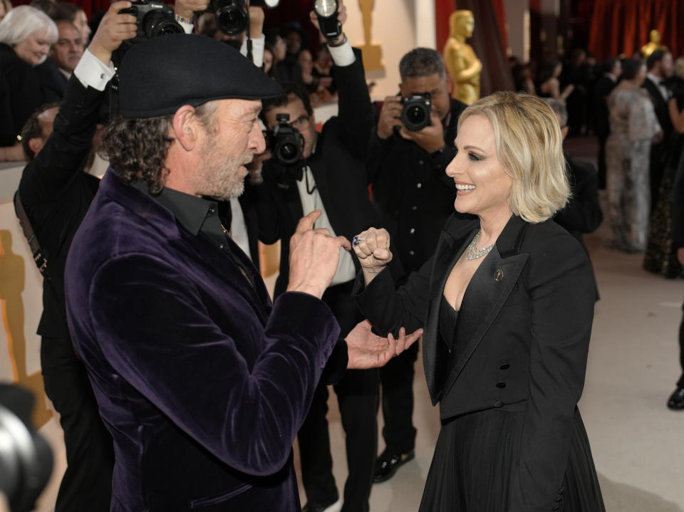 Troy Kotsur, left, and Marlee Matlin arrive at the Oscars on Sunday, March 12, 2023, at the Dolby Theatre in Los Angeles. (AP Photo/John Locher)