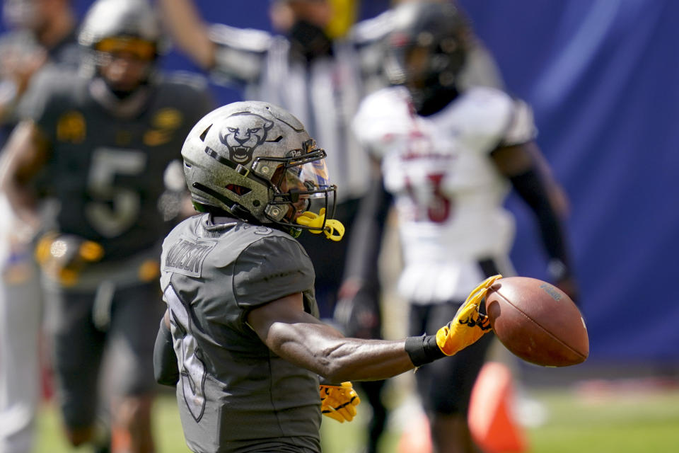 Pittsburgh wide receiver Jordan Addison (3) tosses the ball after making a touchdown catch against Louisville during the first half of an NCAA college football game, Saturday, Sept. 26, 2020, in Pittsburgh. (AP Photo/Keith Srakocic)