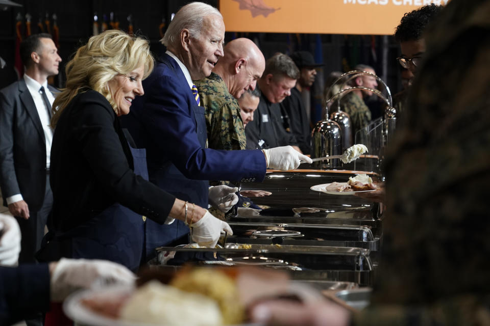 President Joe Biden and first lady Jill Biden serve dinner at Marine Corps Air Station Cherry Point in Havelock, N.C., Monday, Nov. 21, 2022, at a Thanksgiving dinner with members of the military and their families. (AP Photo/Patrick Semansky)