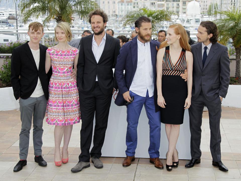 From left actors Dane Dehaan, Mia Wasikowska, Jason Clarke, Tom Hardy, Jessica Chastain and Shia LaBeouf pose during a photo call for Lawless at the 65th international film festival, in Cannes, southern France, Saturday, May 19, 2012. (AP Photo/Francois Mori)