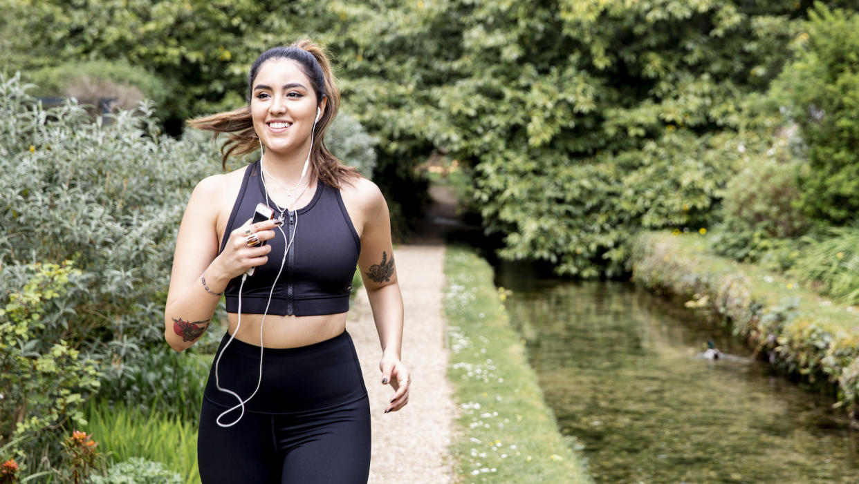  Female runner wearing headphones. 