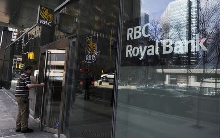 A man walks into a Royal Bank of Canada (RBC) in Toronto March 3, 2011. REUTERS/Mark Blinch