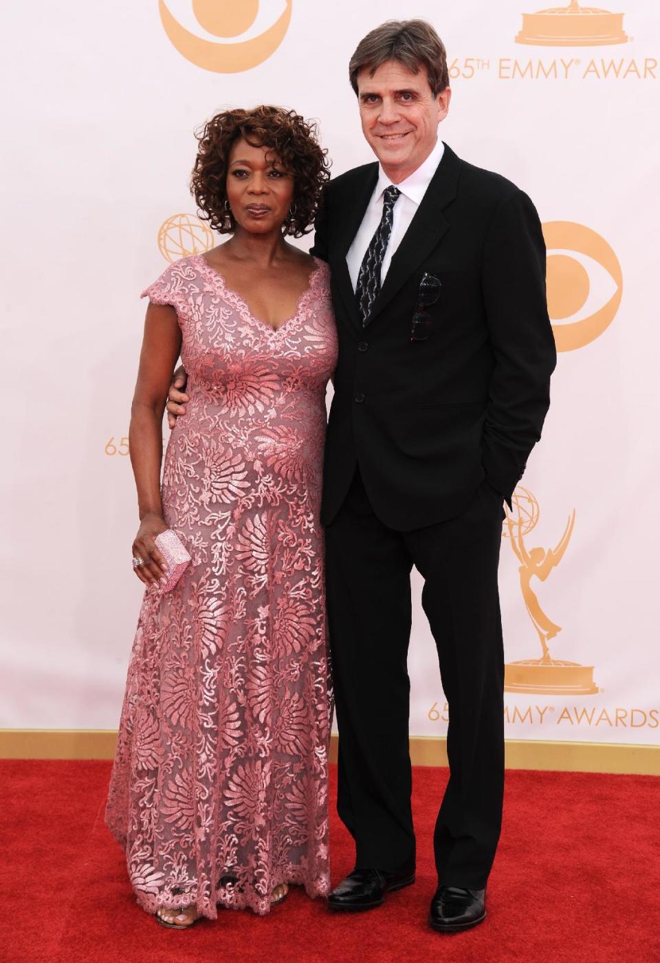 Alfre Woodard, left, and Roderick Spencer arrive at the 65th Primetime Emmy Awards at Nokia Theatre on Sunday Sept. 22, 2013, in Los Angeles. (Photo by Jordan Strauss/Invision/AP)