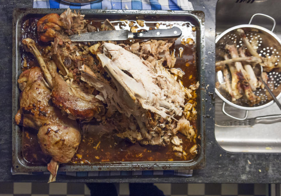 Separate bones from meat before you store your leftover turkey in the fridge or freezer. (Photo: EThamPhoto via Getty Images)