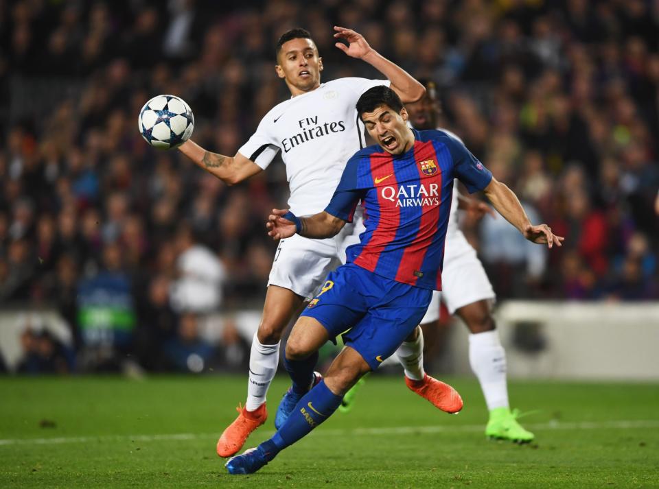 <p>Luis Suarez of Barcelona is challenged by Marquinhos of PSG for a penalty during the UEFA Champions League Round of 16 second leg match between FC Barcelona and Paris Saint-Germain at Camp Nou on March 8, 2017 in Barcelona, Spain. (Photo by Laurence Griffiths/Getty Images) </p>