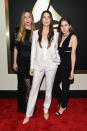 <p>Flanked by her sisters dressed in black, Danielle Haim, center, one third of the family band Haim and BFFs of Taylor Swift, the artist stood out in a white Stella McCartney suit.</p>