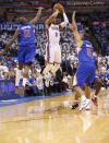 Oklahoma City Thunder guard Russell Westbrook (0) shoots between Los Angeles Clippers guard Jamal Crawford (11) and forward Jared Dudley (9) in the third quarter of Game 2 of the Western Conference semifinal NBA basketball playoff series in Oklahoma City, Wednesday, May 7, 2014. Oklahoma City won 112-101. (AP Photo/Sue Ogrocki)