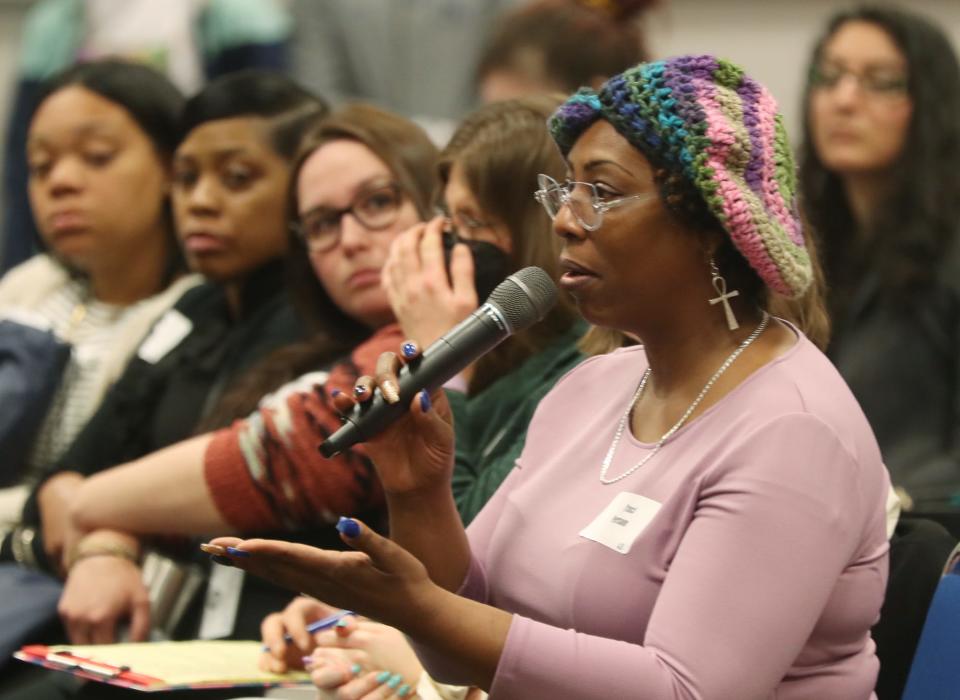 Traci Person asks a question April 28 at the 2022 Eviction Prevention Summit at the John S. Knight Center in Akron.