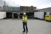 In this March 16, 2017 photo, Robert Waddle, division operations manager at the West Point Treatment Plant in Seattle, stands near bay doors where floodwaters rushed in to the sewage treatment plant during a massive equipment failure that crippled operations and caused millions of gallons of raw sewage and untreated runoff to pour into the United States' second largest estuary. (AP Photo/Ted S. Warren)