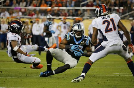 Carolina Panthers' Devin Funchess makes a first down catch in front of Denver Broncos' Bradley Roby and Aqib Talib in the fourth quarter of the NFL's Super Bowl 50 football game in Santa Clara, California February 7, 2016. REUTERS/Mike Blake