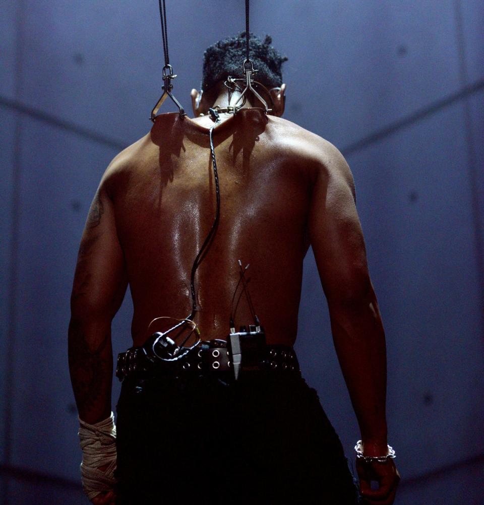 Miguel hangs from two rods pierced in his back (Getty Images for Sony)