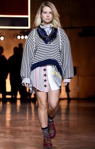 <p>Gareth Cattermole/BFC/Getty</p> Kate Moss' sister Lottie Moss walks the runway at the TommyNow show during London Fashion Week February 2020 at the Tate Modern on Feb. 16, 2020 in London, England.