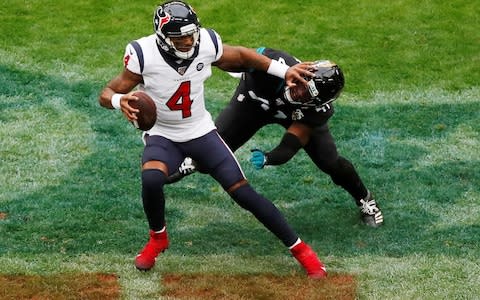 Houston Texans' Deshaun Watson in action with Jacksonville Jaguars' Josh Allen Action - Credit: Reuters
