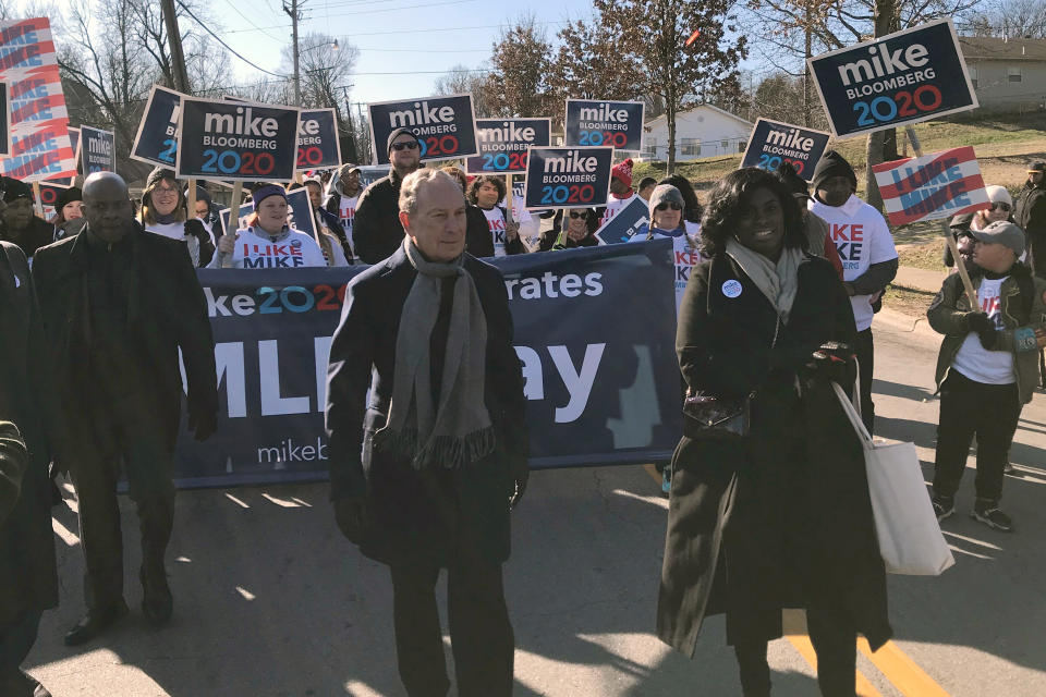 In this Jan. 20, 2020 photo, former New York City Mayor, and Democratic presidential candidate Michael Bloomberg walks with supporters along the route of the Little Rock "marade" marking the Martin Luther King Jr. holiday in Little Rock, Ark. (AP Photo/Andrew DeMillo)