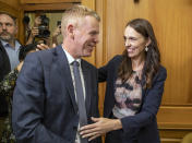 New Zealand Prime Minister Jacinda Ardern, right, and new Labour Party leader Chris Hipkins arrive for their caucus vote at Parliament in Wellington, Sunday, Jan. 22, 2023. Hipkins got the unanimous support of lawmakers from his party after he was the only candidate to enter the contest to replace Ardern, who shocked the nation of 5 million people last Thursday when she announced she was resigning. (Mark Mitchell/New Zealand Herald via AP)