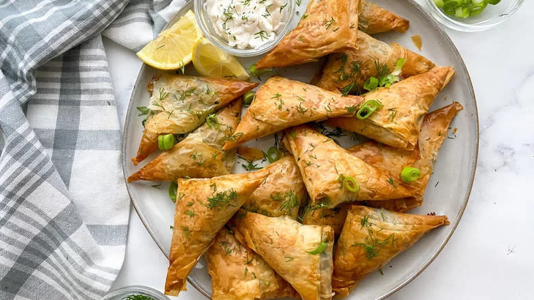 Plate of spanakopita with lemon