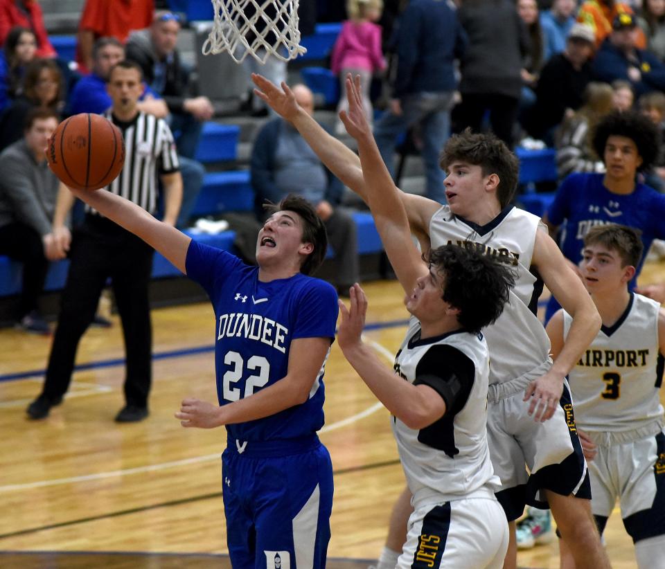 Drew Bolster of Dundee goes underneath with a nice move to score past the Milan players in the Division 2 District semifinals at Dundee High School Thursday.