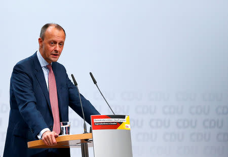 Christian Democratic Union (CDU) candidate for the party chair Friedrich Merz delivers a speech as he attends a regional conference in Duesseldorf, Germany, November 28, 2018. REUTERS/Thilo Schmuelgen/Files