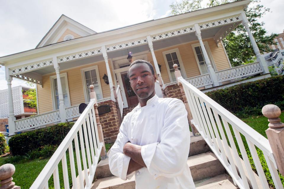Zacchaeus Golden, chef and owner of Southern Soigne, stands outside his Jackson, Miss., restaurant Tuesday, May 24, 2022. Golden elevates Southern cooking with his chef's tasting and à la carte menu options. Using French technique, inspiration from generations of recipes, and constantly-evolving menus, Golden changes his courses to reflect the seasons.