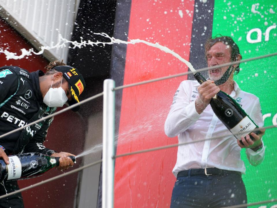 Race winner Lewis Hamilton of Great Britain and Mercedes GP celebrates with Ineos CEO Sir Jim Ratcliffe on the podium during the F1 Grand Prix of Spain at Circuit de Barcelona-Catalunya on May 09, 2021 in Barcelona, Spain.