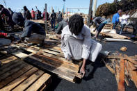 African migrants build a makeshift house after their houses burned, on the outskirts of Casablanca, Morocco October 29, 2018. REUTERS/Youssef Boudlal